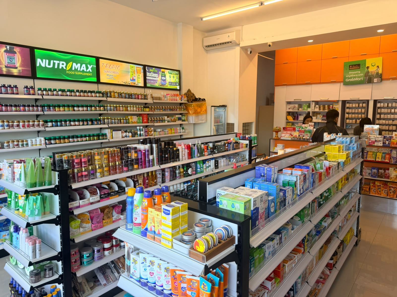 Pharmacy counter and shelves inside a Semeton store