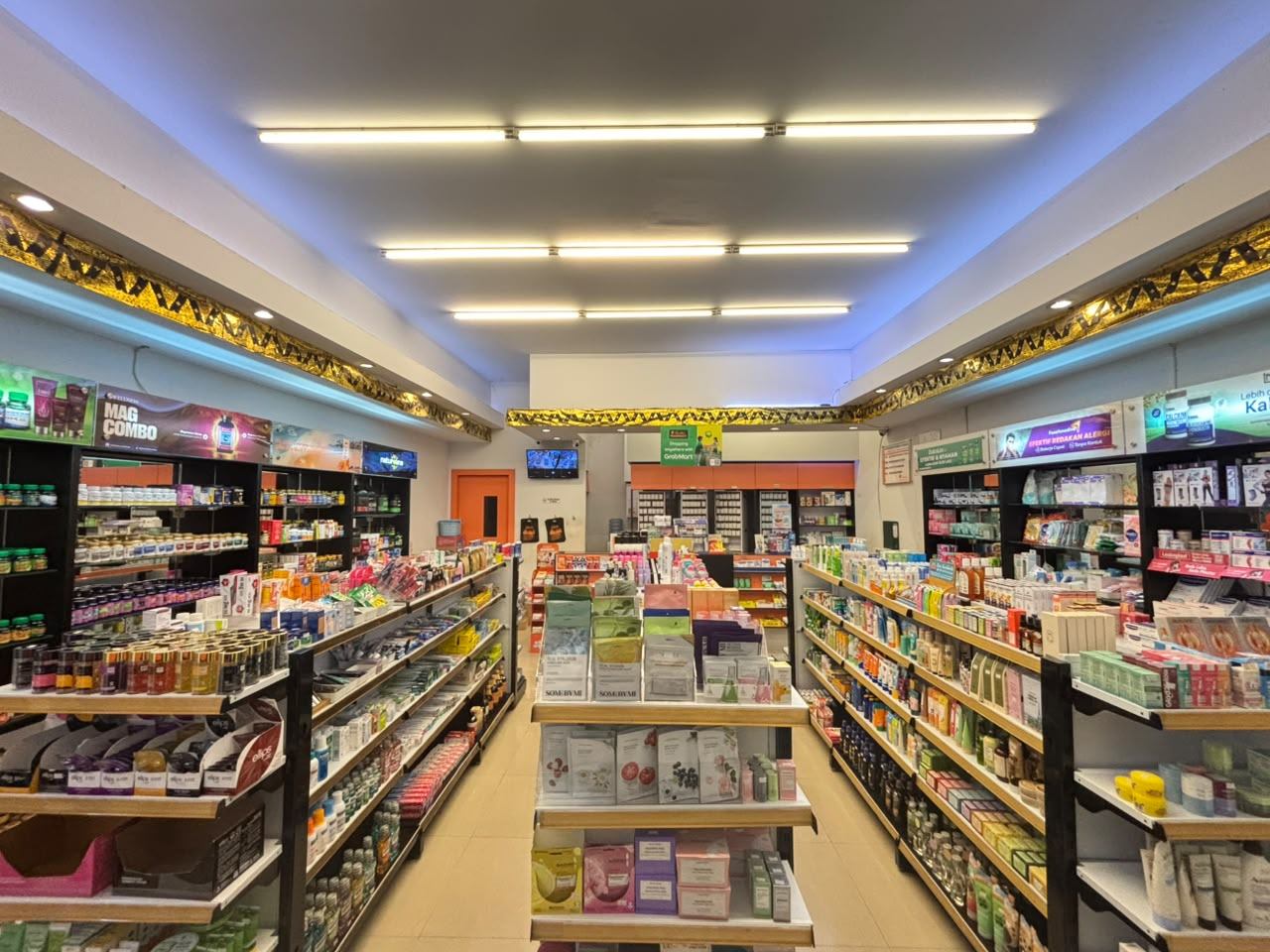 Bright, well-stocked aisles inside a Semeton Pharmacy